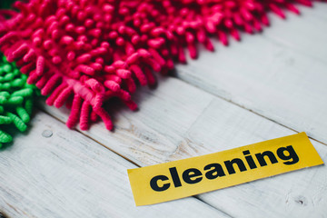 Keep your house clean and healthy with a fluffy red and green cotton mops. Contrast composition of...