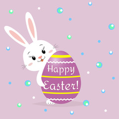 The Easter rabbit peeps out from behind a purple decorative egg. Congratulations on Easter.