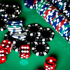 High contrast image of casino roulette and poker chips