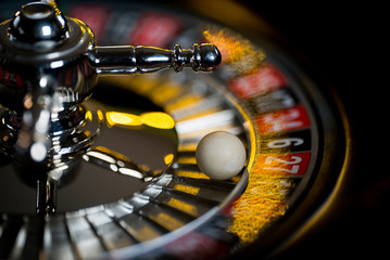High contrast image of casino roulette and poker chips