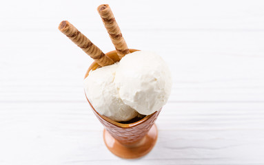 Ice cream stands on a table, on a black background.