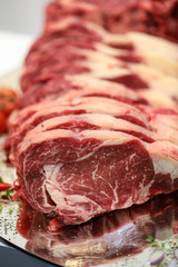 Close up of raw meat on cutting board
