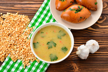 Pea soup with pies. Top view. Space for text or design.