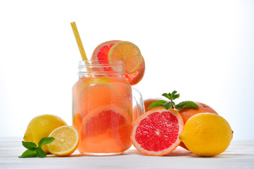 Naklejka na ściany i meble Ice refreshing summer drink with lots of different fruits. Space for text or design.