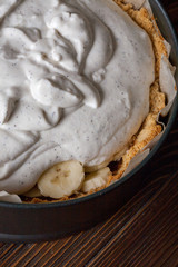 Moody Banoffee pie closeup with bananas showing
