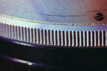 Old manual control lens body. Scratches and dirt. Close-up on the numbers of aperture ring. Concept...
