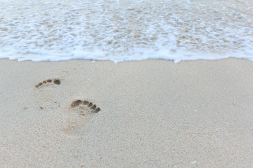 Close up footprint in clean sand.