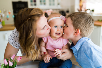 Mother and her kids playing