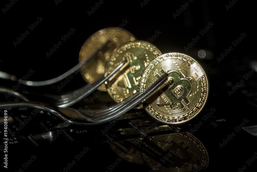 Aufkleber golden bitcoin with fork and two blurred bitcoins above.hard fork change concept