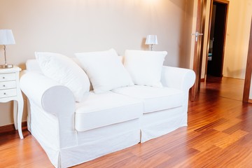 White modern fabric sofa in room
