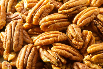 Pecans nuts. A close-up photograph. Unrefined whole kernel 