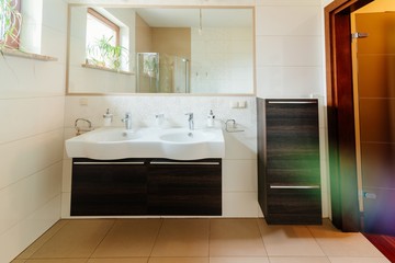 Fototapeta na wymiar Modern bathroom with double washbasin