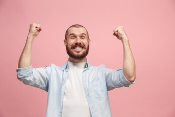 Winning success man happy ecstatic celebrating being a winner. Dynamic energetic image of male model