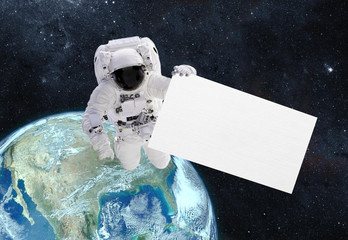 Astronaut with banner. Elements of this image furnished by NASA