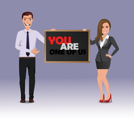 Funny Guy in casual business clothes with beautiful woman in business clothes with chalkboard with text You are one of us