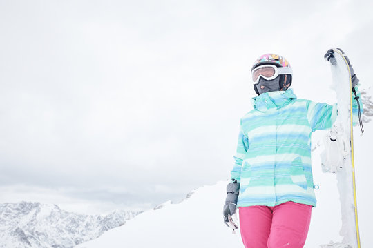 Young woman with snowboard