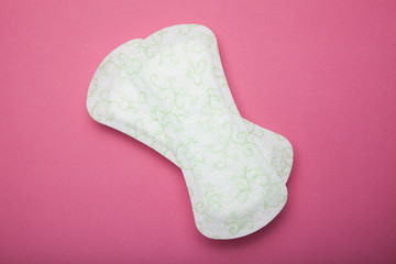 Pads on a pink background, menstruation concept.