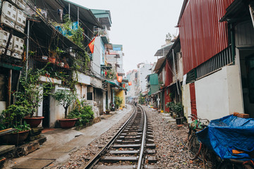 Fototapeta na wymiar HANOI, VIETNAM - 03 JANUARY, 2018: empty railroad between buildings in Hanoi, Vietnam