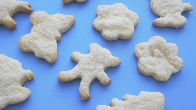 Sugar cookies. Smooth rotation on blue background.