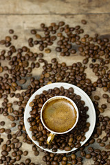 A cup of cappuccino on a wooden table