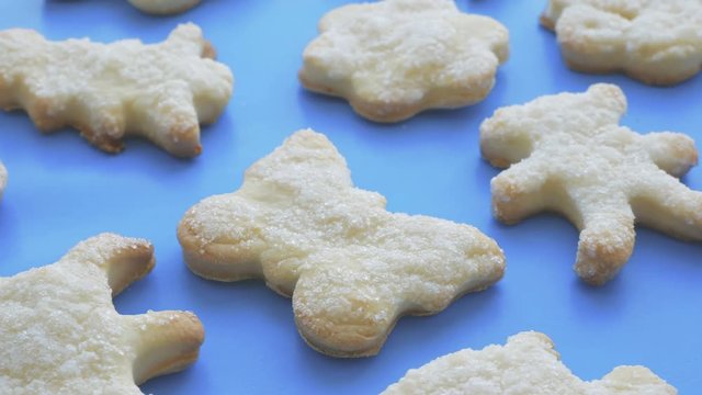 Sugar cookies. Smooth rotation on blue background.