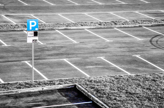 Parking lot with blue sign