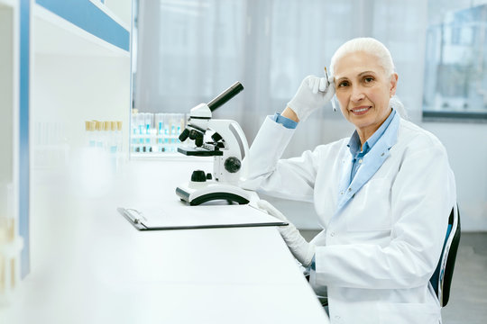 Clinical Test. Female Scientist Working In Laboratory.