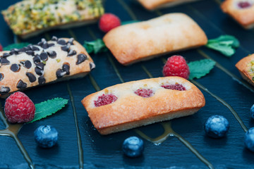 Vegan cakes decorated with mint and berries.