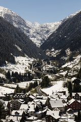 Fototapeta premium Gotthard motorway in winter with traffic jam in front of the Gotthard tunnel. In the foreground Goeschenen and in the background Schoellenen in central Switzerland