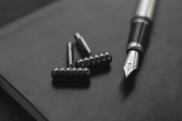 Fototapeta premium Black style Man set: notepad, pen and cufflinks. Black background