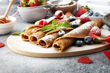 Gardinen Delicious Tasty Homemade crepes or pancakes with raspberries and blueberries © beats_