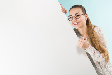 Attractive young woman with blank banner