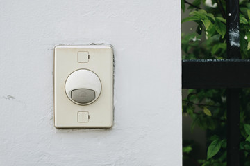 Door bell on white wall