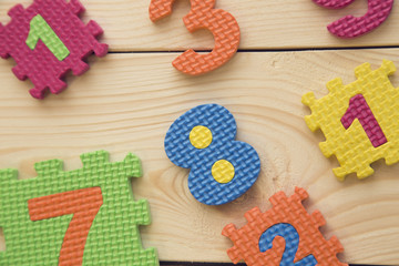 Colorful numbers on a wooden table, flat lay