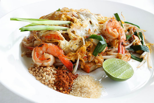 Thai food Pad thai , Stir fry noodles with shrimp in white dish with seasoning.