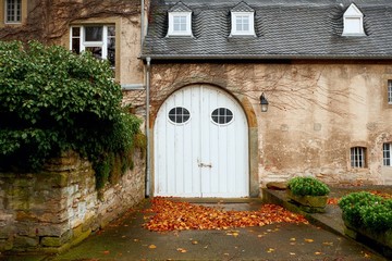 Fototapeta na wymiar Wooden entrance gate of manor in Germany, Europe