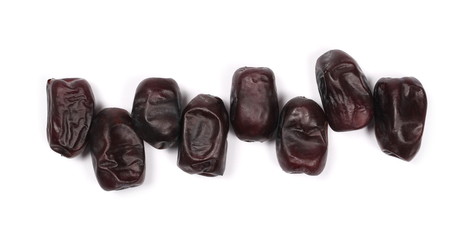 Pile dry dates isolated on white background, sweet fruit, top view