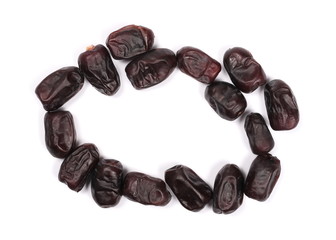 Pile dry dates in circular shape isolated on white background, sweet fruit, top view