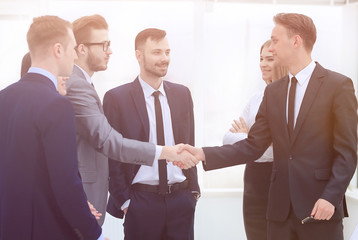 handshake Manager and the client in the office