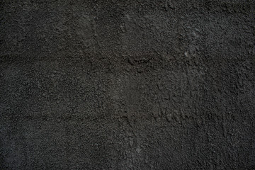 Fur coat of cement with sand of dark gray color solid concrete