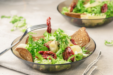 Frisee lettuce salad with sun dried tomatoes