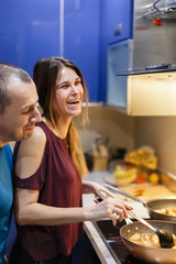 couple in home cooking kitchen