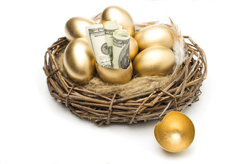 Nest with golden eggs on a white background. Golden Eggs in Nest with of Dollars