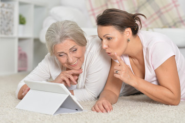 Mother and her using tablet