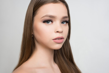 Fototapeta premium Closeup image of beautiful blue-eyed woman eye with fashion makeup and long eyelashes