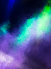 Multi-colored smoke at the concert at night