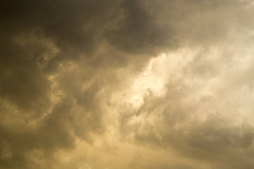 Storm clouds in the sky at sunset as background
