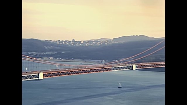 Car traffic in eighties of Golden Gate Bridge from Presidio overlook. Archival San Francisco, California, United States in 1980.