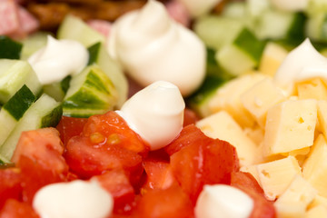 Mayonnaise on a salad on a table