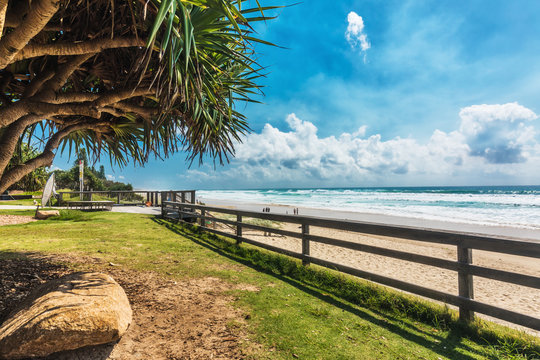 COOLUM, AUSTRALIA, FEB 18 2018: People enjoying summer at Coolum main beach - famous tourist destination in Queensland, Australia.